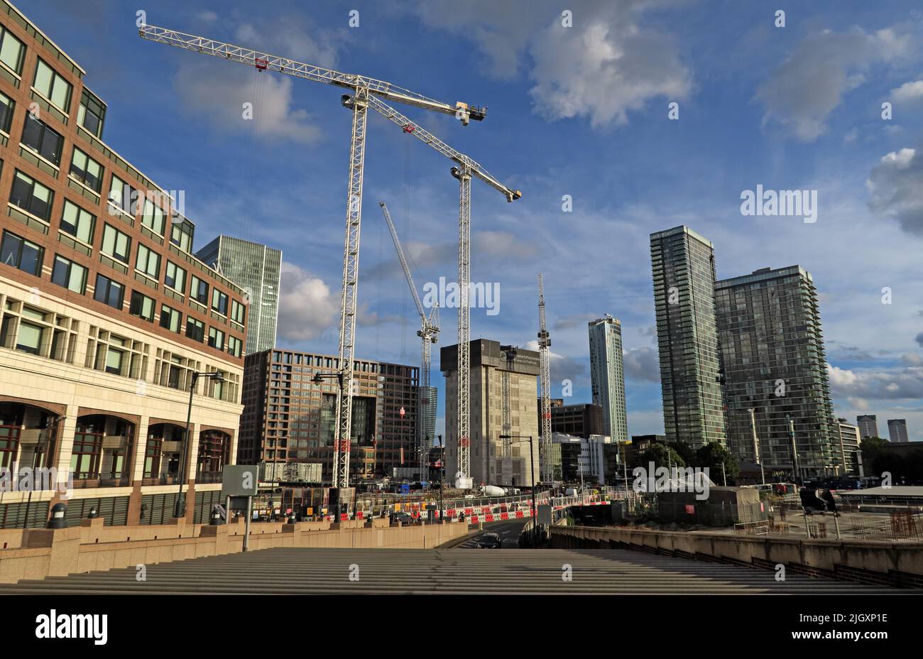 New apartments, East London dockland building cranes development, Canary Wharf, England, UK Stock Photo