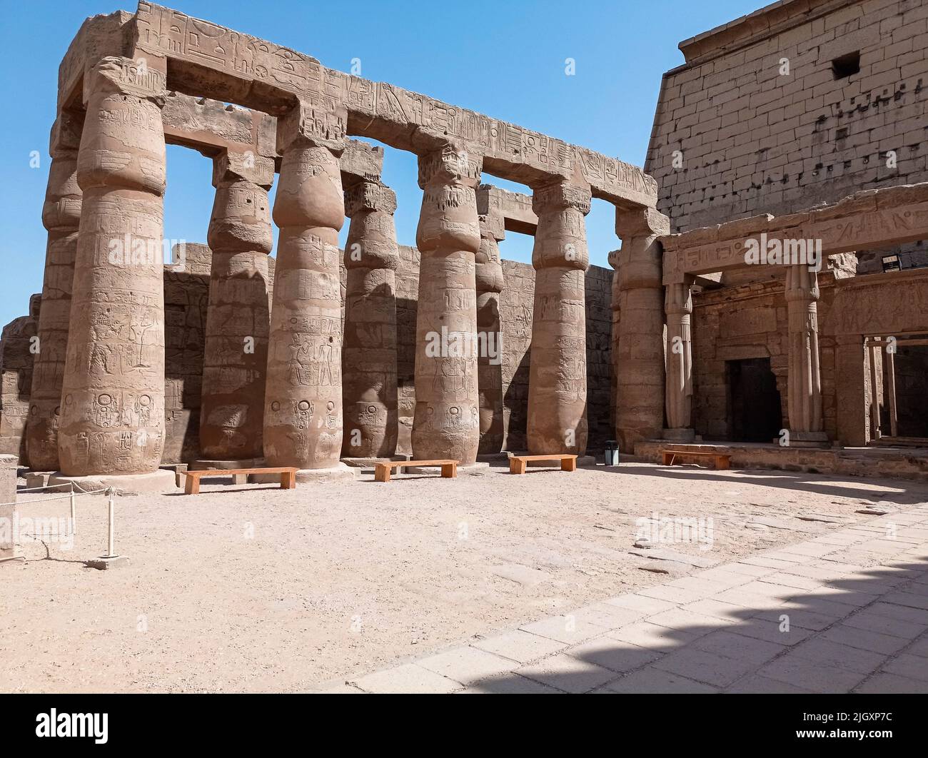 Ruins of an ancient egyptian temple with columns full of hieroglyphs in ...