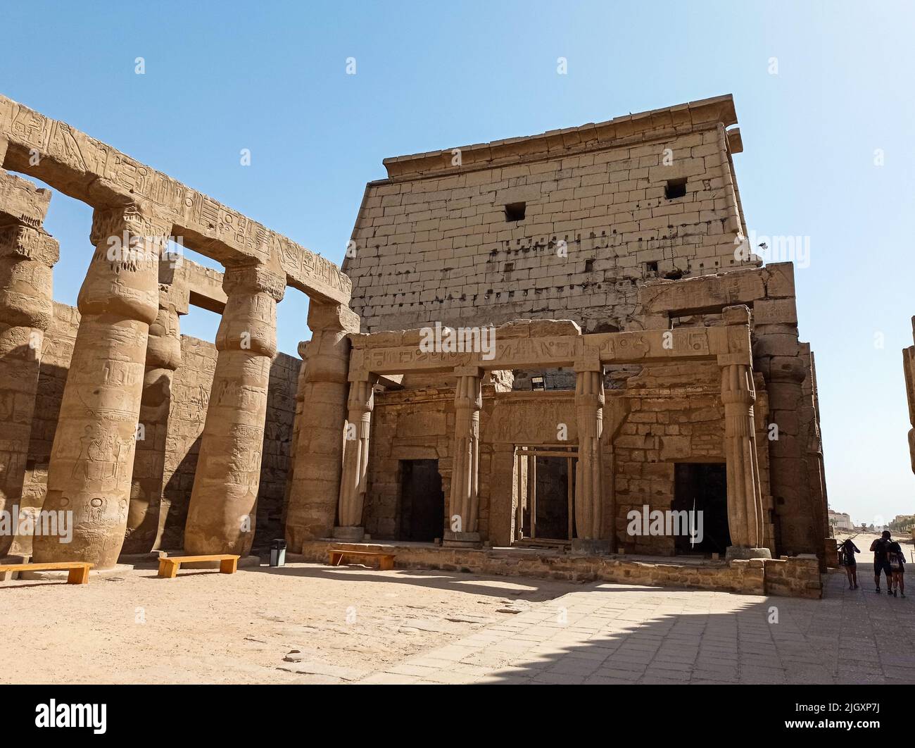 Ruins of an ancient egyptian temple with columns full of hieroglyphs in ...