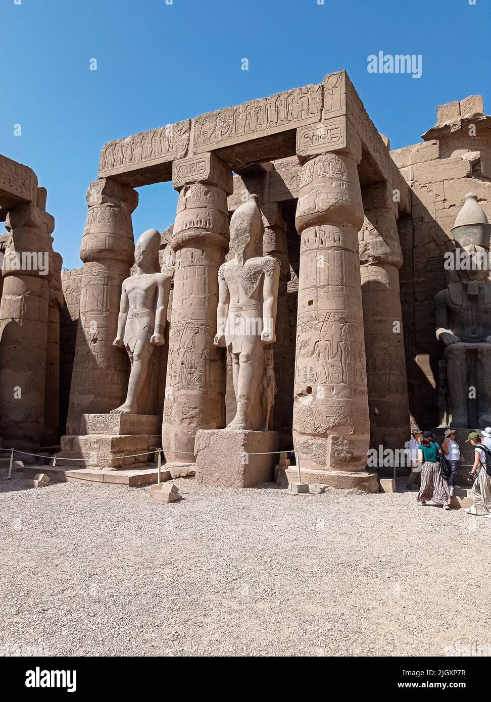 Ruins of an ancient egyptian temple with columns full of hieroglyphs ...