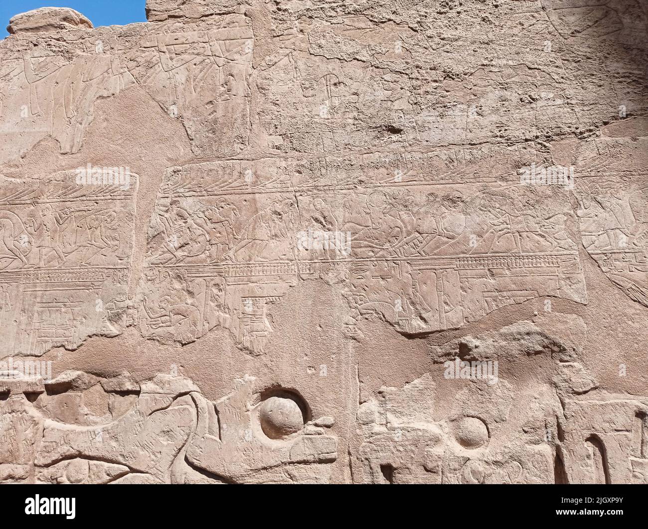 Detail of the hieroglyphs carved on the stone of an ancient wall in