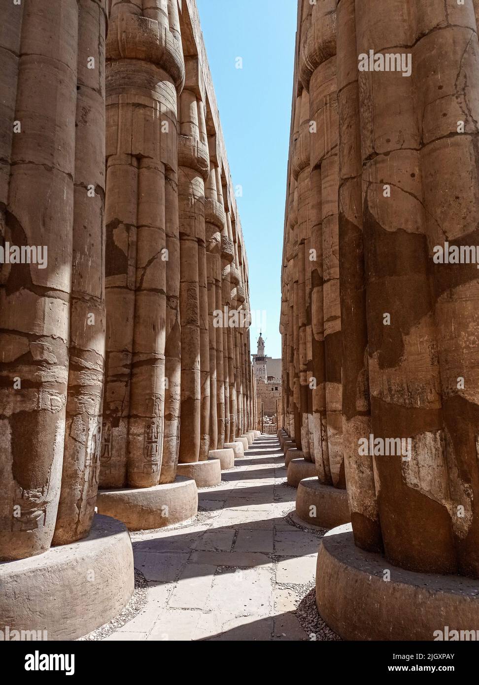 Ruins of an ancient egyptian temple with columns full of hieroglyphs ...