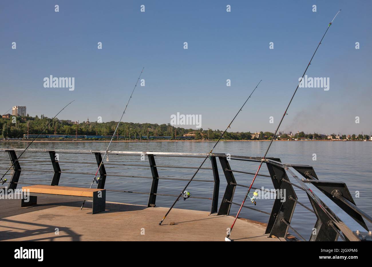 Mariupol, Ukraine July 15, 2021 Fishing rods on the pier of the city