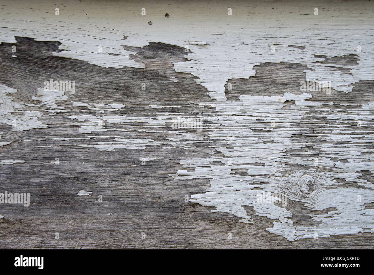 Abstract peeling old paint pattern on weathered wood surface Stock Photo