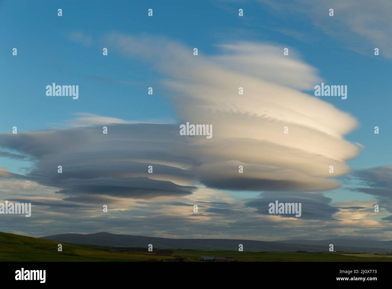 Altocumulus Lenticularis clouds, Orkney Isles Stock Photo