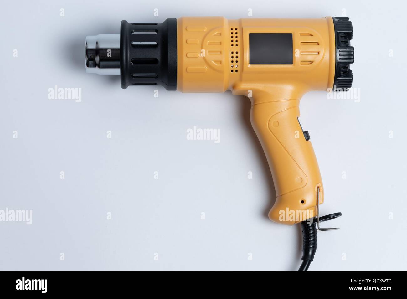 Yellow heat gun tool for blowing hot air isolated Stock Photo