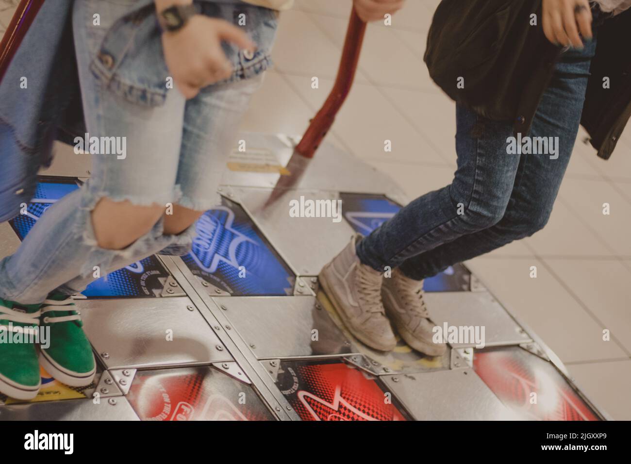 foot of two people dancing on the pump it up machine Stock Photo Alamy
