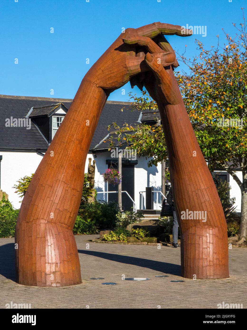 Gretna Green, Scotland - October 15th 2021: Clasping Hands sculpture in the village of Gretna Green, Scotland. The location is famous for eloping coup Stock Photo
