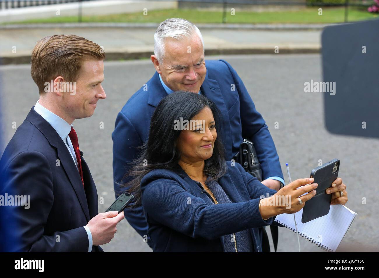 London, UK. 07th July, 2022. Sky News political correspondent Rob Powell (L), BBC television journalist, Geeta Guru-Murthy (C) and BBC News presenter Huw Edwards (R) pose for a selfie on Downing Street in central London. Credit: SOPA Images Limited/Alamy Live News Stock Photo