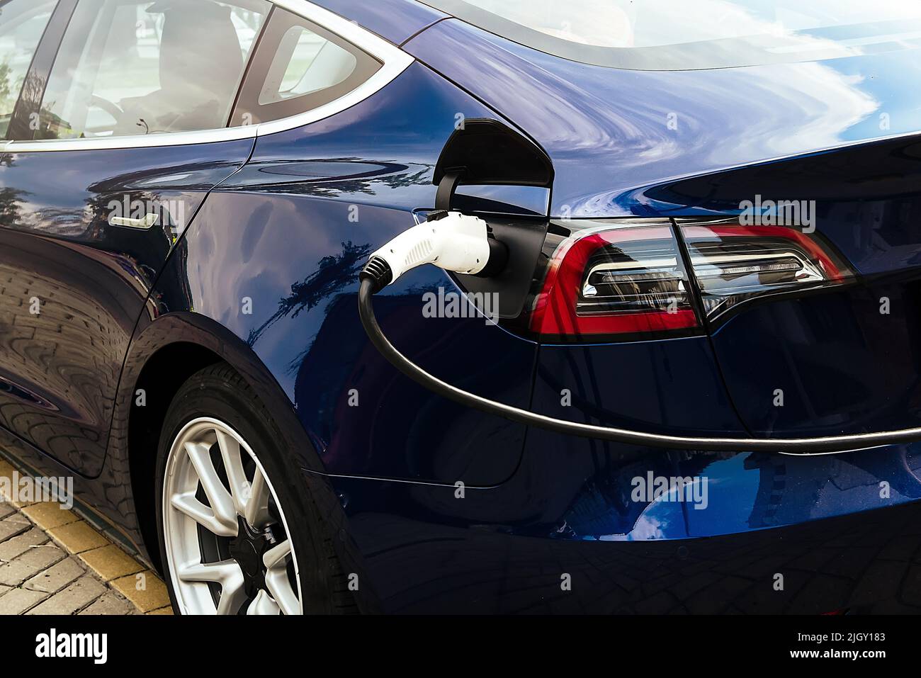 Electric car at the charging station. Ecology. Eco-friendly transport ...