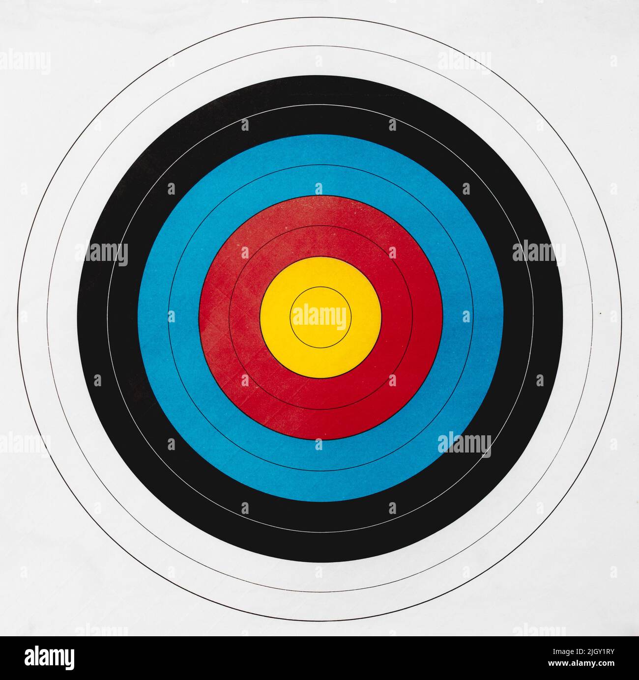 Multi color paper shooting target with yellow bullseye Stock Photo