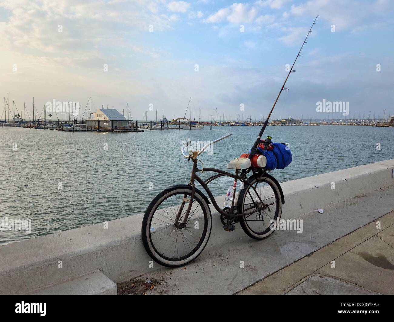 A panoramic view of  bicycle against Waters Edge Fishing Camp, Corpus Christi, USA Stock Photo