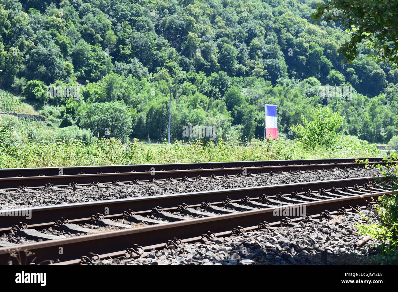 railroad tracks with a French flag Stock Photo Alamy
