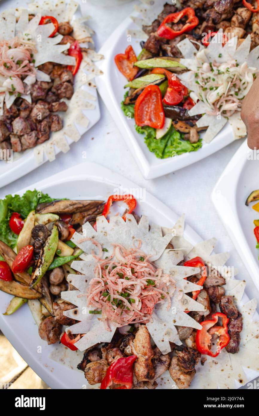 pieces of meat kebab with vegetables top view Stock Photo - Alamy