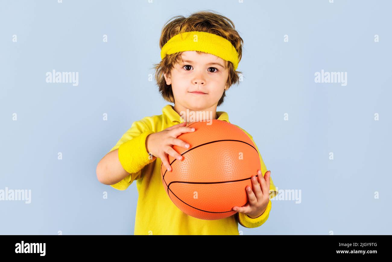 Boy in sportswear with ball. Basketball player. Sports for children. Active sport, healthy lifestyle. Stock Photo