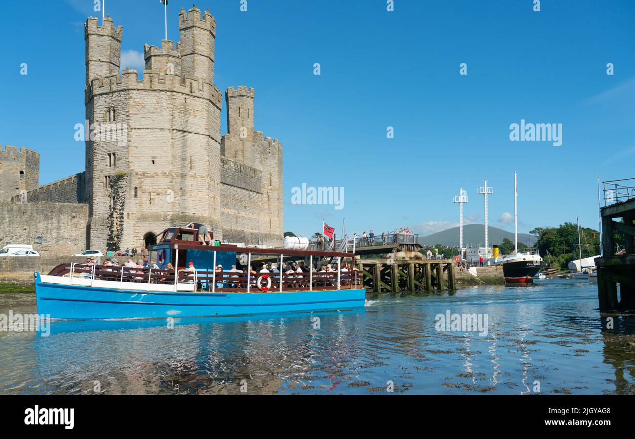 The Queen of the sea pleasure boat on the river Seiont, that runs into the Menai Straits, by Caernarfon in North Wales. Image taken in July 2022. Stock Photo