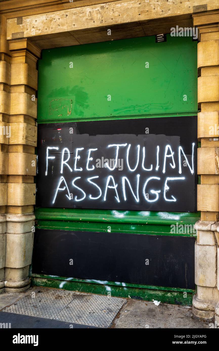 Free Julian Assange graffiti in Central London. Julian Assange protest. Stock Photo