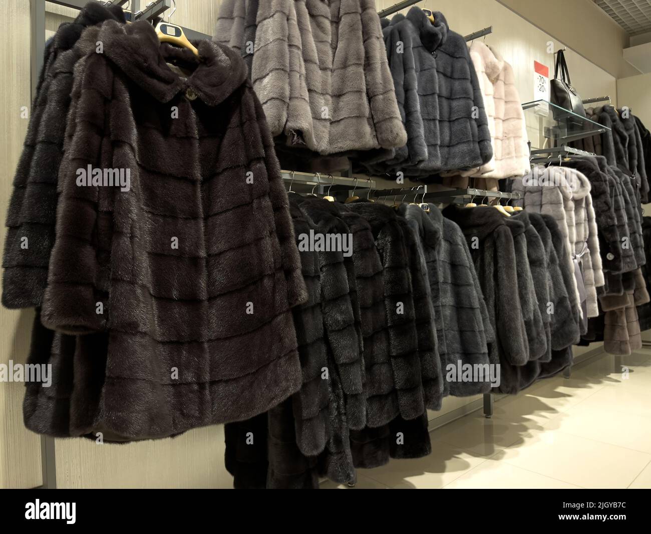 Fur coats for women in the shop display Stock Photo Alamy