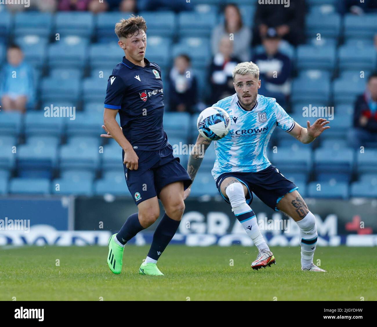 13th July 2022, Dens Park, Dundee, Scotland: Pre-season friendly football, Dundee versus Blackburn Rovers; Harry Leonard of Blackburn Rovers challenges for the ball with Tyler French of Dundee Stock Photo