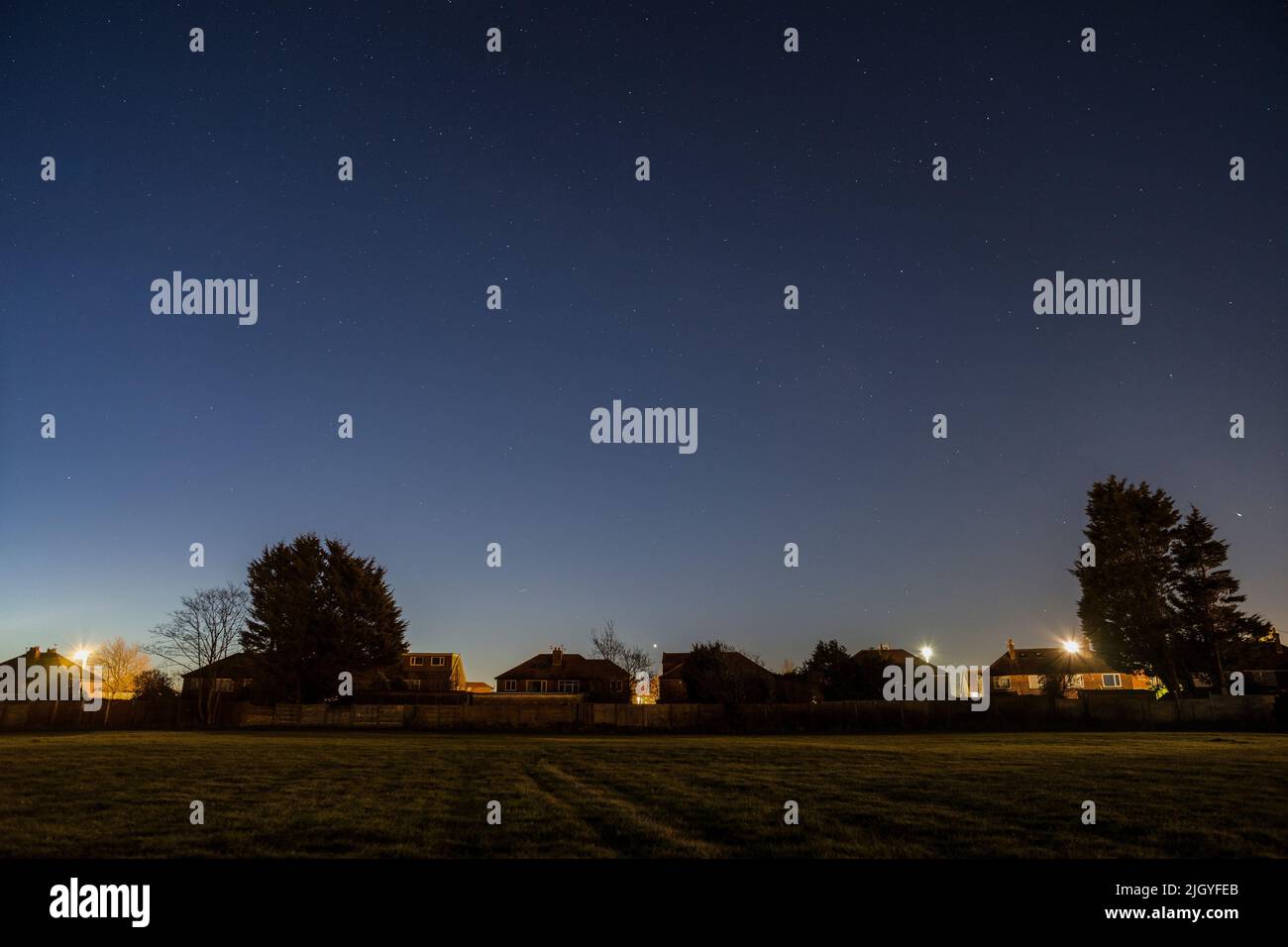 A view of the farm houses in the field and a starry night Stock Photo ...