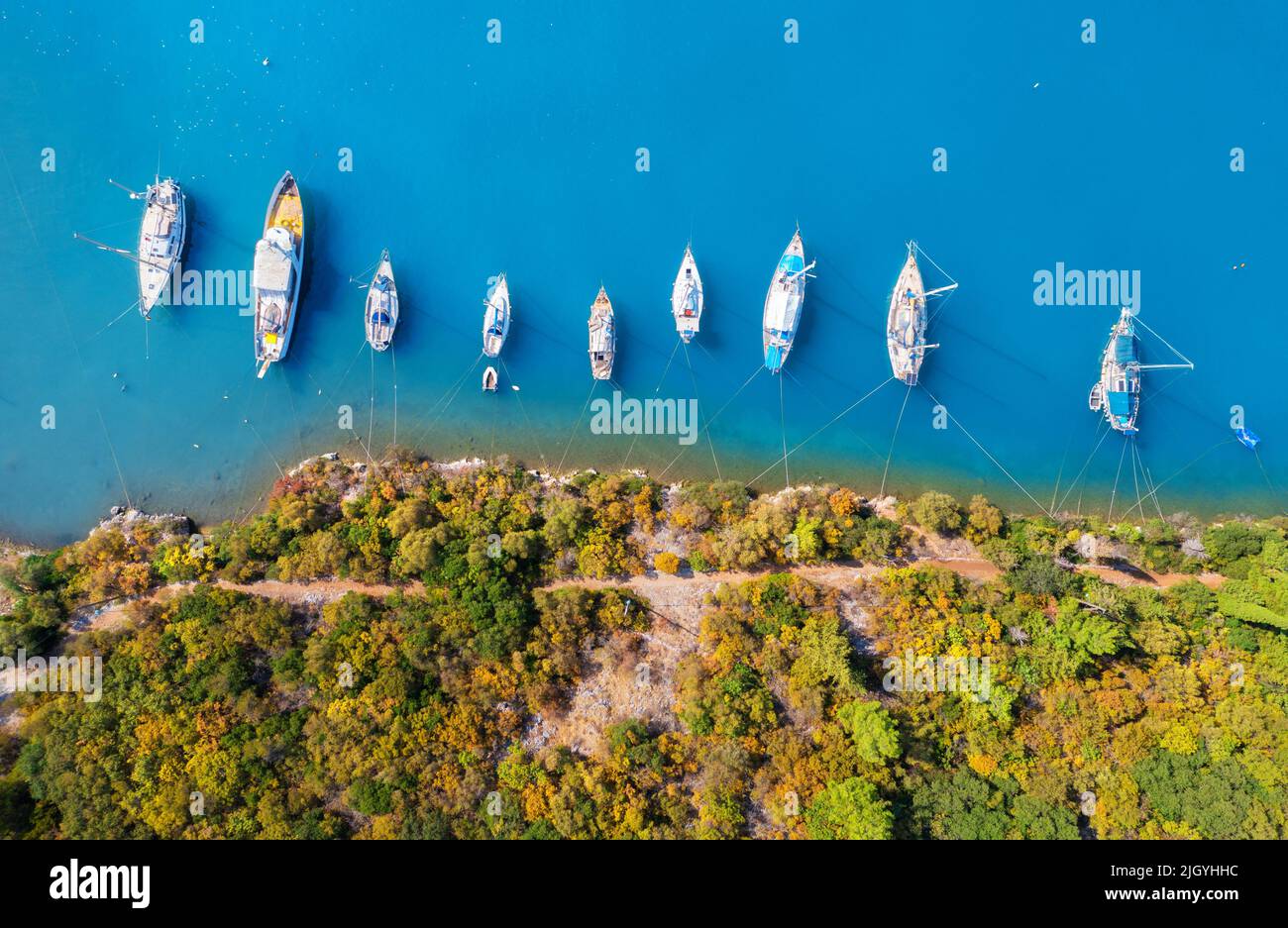 Aerial view of beautiful yachts and boats on the sea at sunset Stock Photo