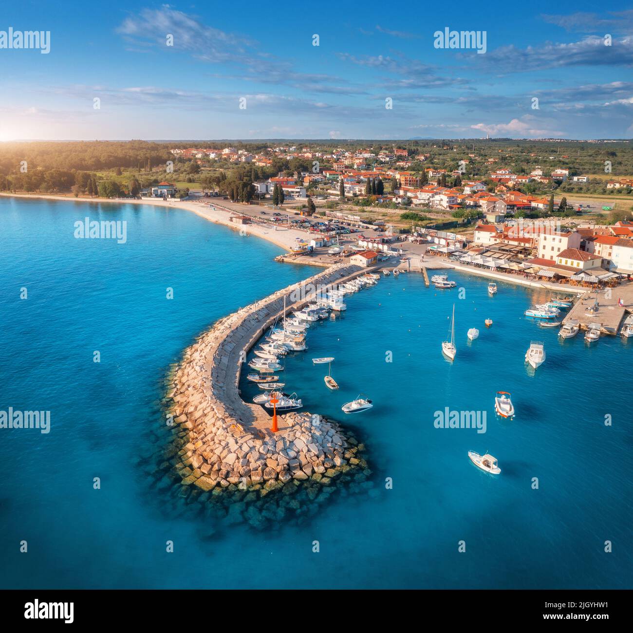 Aerial view of boats and yachts in dock, breakwater and blue sea Stock Photo
