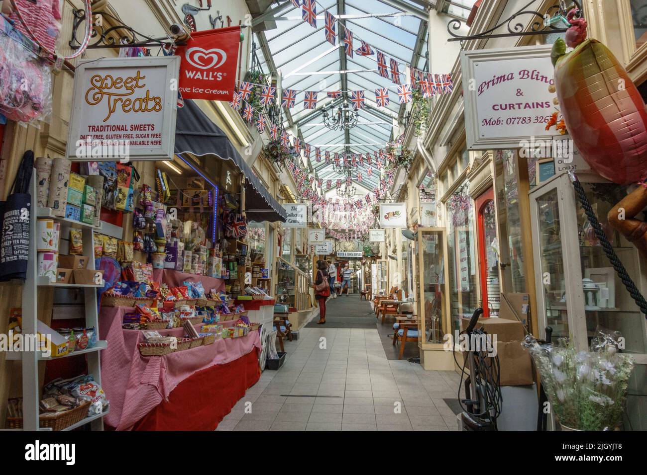 View down line of shops inside Jackson's Arcade (or Kirkgate Arcade) in Otley, West Yorkshire, UK. Stock Photo