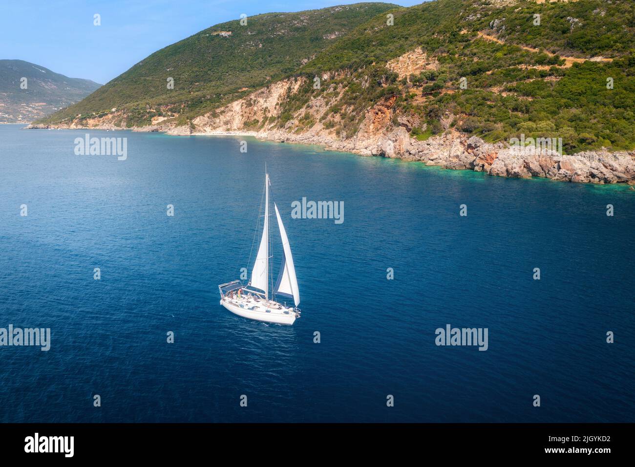 Aerial view of beautiful yacht. Boat on the sea at sunset Stock Photo