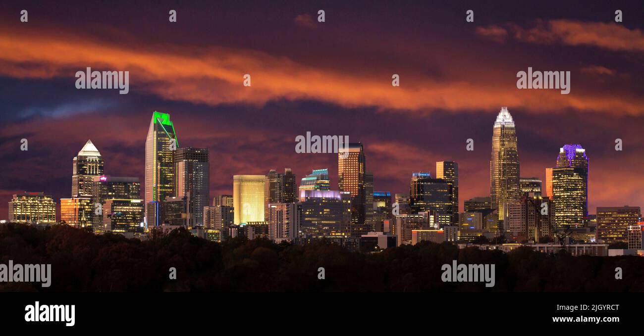 Brillinatly lit clouds at sunset form the backdrop for the skyline of downtown Charlotte, North Carolina. Stock Photo