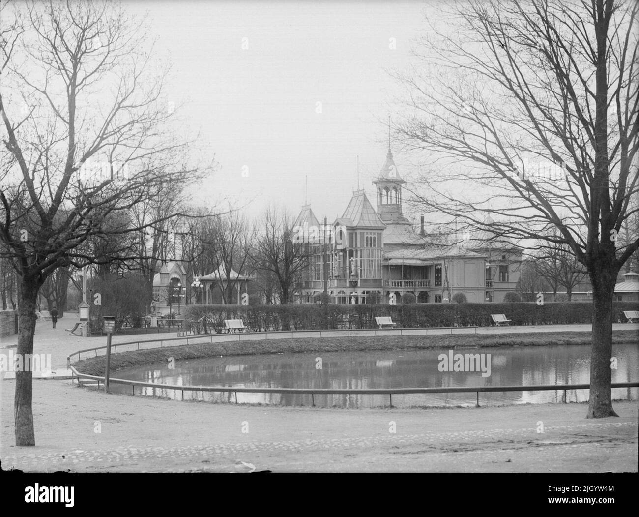 Fluster and Svandammen from North, Fjärdingen, Uppsala 1901 - 1902. Fluster and Svandammen. The first fluster, a small simple pavilion near Fyrisån, was erected in 1842. Here, during the summer months, the young confectioner Norberg served, including coffee, tea, chocolate and soft drinks with snacks. In 1858, the small pavilion was replaced with a new one on two floors slightly further from the river. But it was not until a major rebuild in the early 1870s that the Fluster got its well-known figure with festively designed towers and balconies. 'From Ola Ehn & Gunnar Elfström, the turn of the Stock Photo