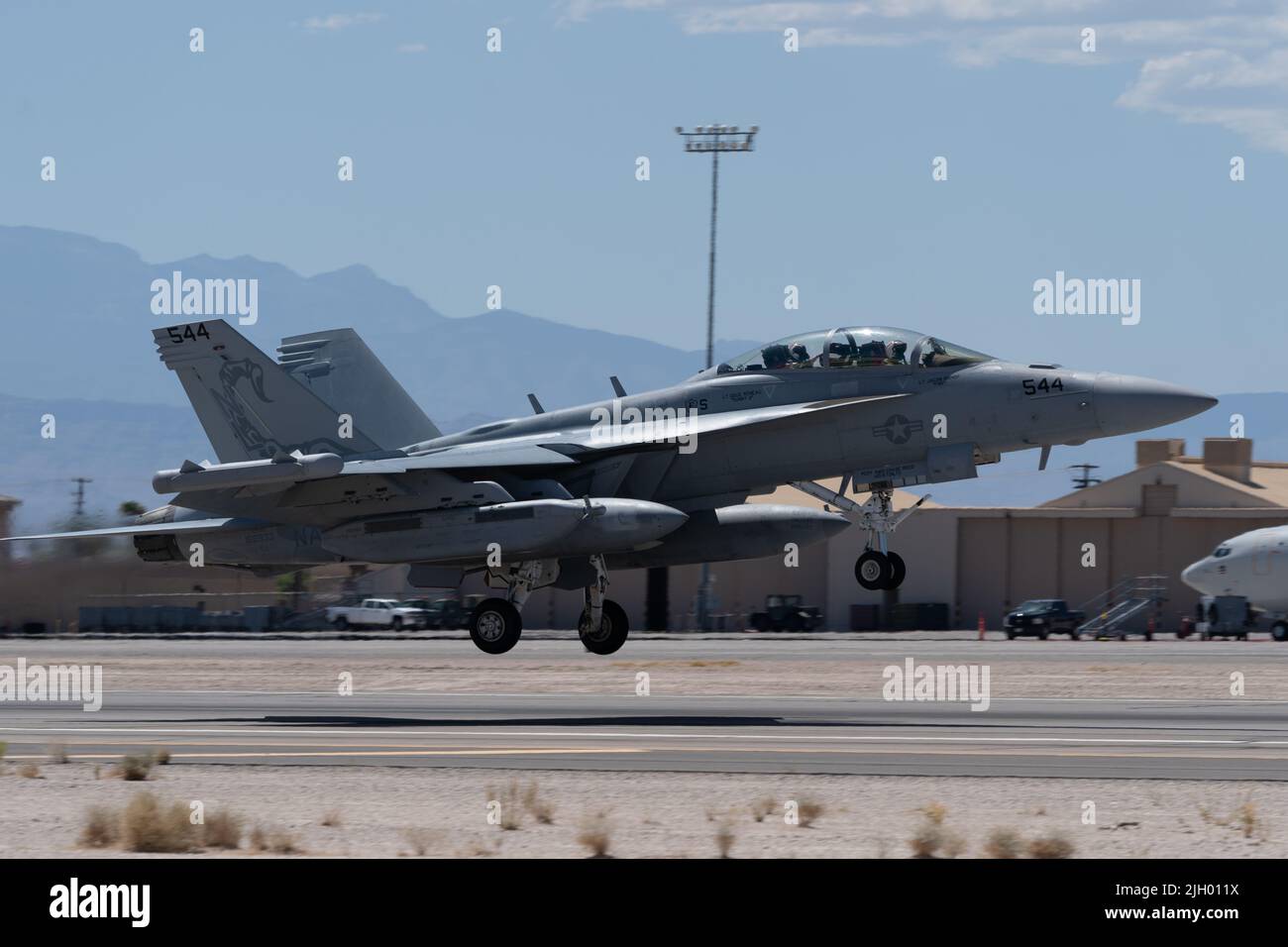 An EA-18G Growler assigned to the VAQ-132 Electronic Attack Squadron, Whidbey Island Naval Air Station, takes off during Red Flag-Nellis 22-3 at Nellis Air Force Base, Nevada, July 11, 2022. RF-N 22-3 includes more than 17 units and approximately 2,000 participants. (U.S. Air Force photo by Airman 1st Class Josey Blades) Stock Photo