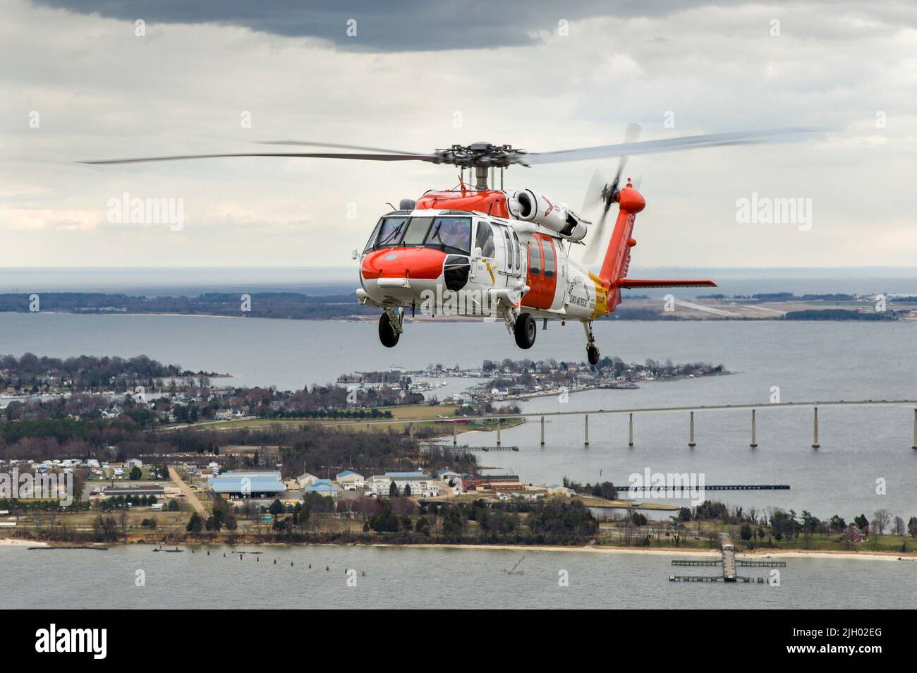 PATUXENT RIVER, Maryland (March 28, 2013) - U.S. Navy Search and Rescue (SAR) helicopter MH-60S Seahawk, Bureau # 165766, conducts a low-level flight from NAS Patuxent River, MD through DC and Baltimore to practice form flying on 27 March 2013. Pilots of the MH-60S are US Navy's CDR Chris McHugh and LCDR Jake Brynjelsen. (RELEASED / U.S. Navy Photo by Liz Wolter) Stock Photo