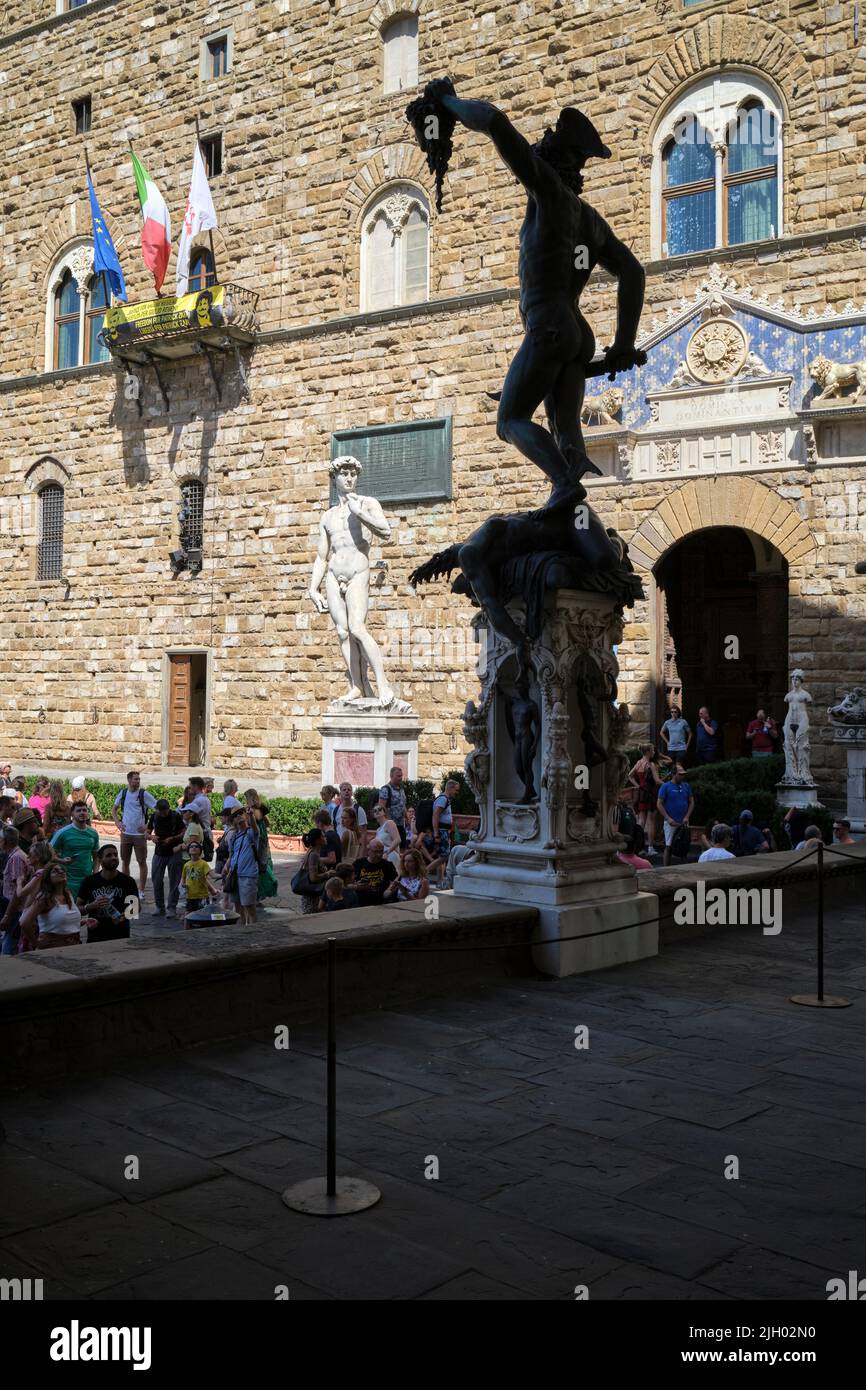 Perseus by Benvenuto Cellini with David Staue in Background Loggia dei Lanzi Piazza della Signoria Florence Italy Stock Photo