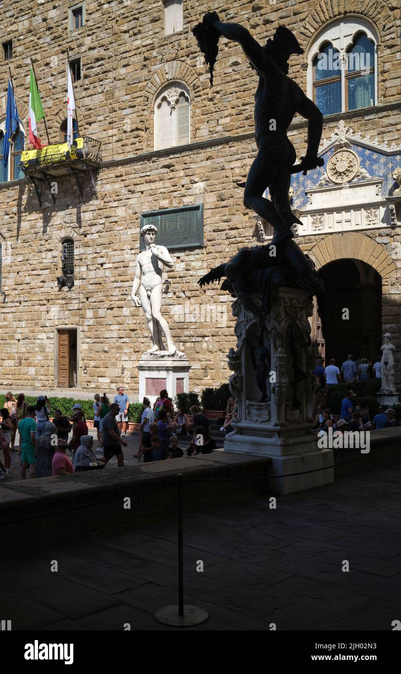 Perseus by Benvenuto Cellini with David Staue in Background Loggia dei Lanzi Piazza della Signoria Florence Italy Stock Photo