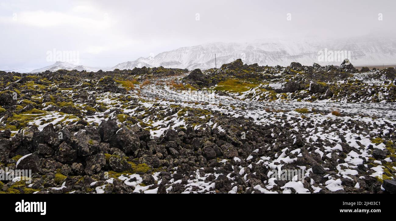 First sprinkles of now over some lava fields on Snæfellsnes Peninsula in West Iceland Stock Photo