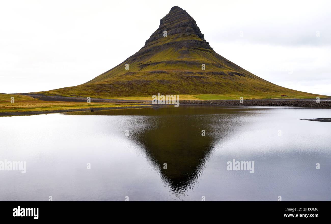 Kirkjufell is by now an iconic mountain in Iceland. 'A mountain shaped like an arrowhead', was the description it was given in Game of Thrones, but lo Stock Photo