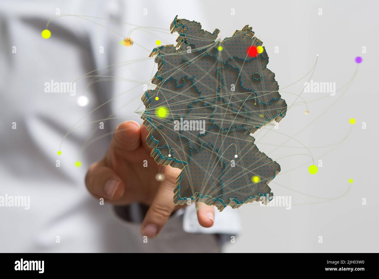 A person presenting a virtual projection of the map of Germany Stock