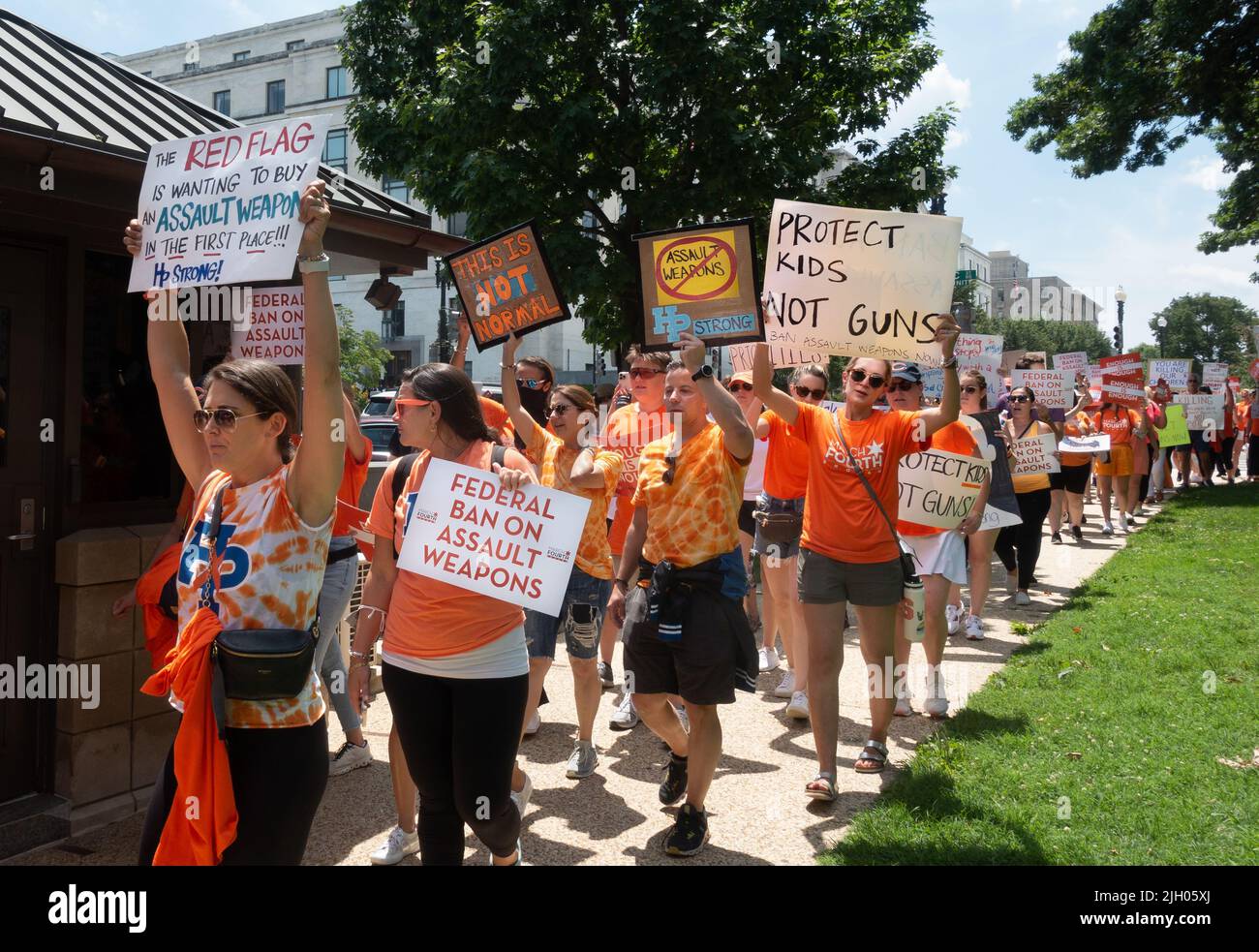 Washington, DC. July 13, 2022: Demanding stricter gun laws, including an assault weapons ban, demonstrators, including families of victims from mass shootings at the 4th of July parade shooting in Highland Park, Illinois, and the Uvalde, Texas school shooting, march from their March Fourth rally near the US capitol. Stock Photo
