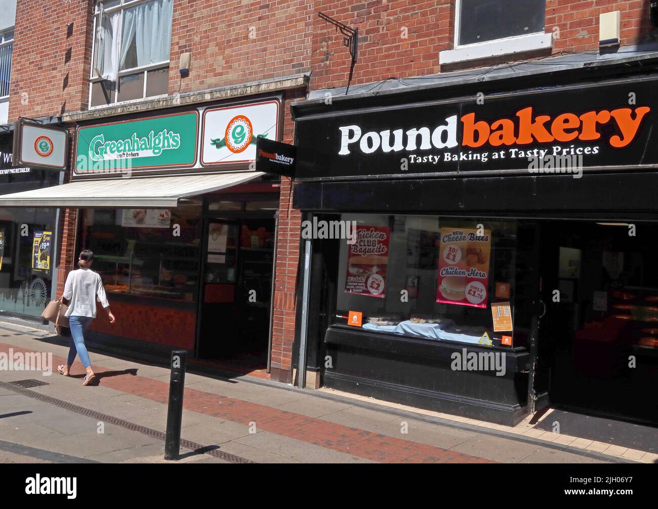 Two bakeries Leigh Greenhalghs & Pound Bakery, 41 Bradshawgate, Leigh, Lancashire, England, UK, WN7 4NB Stock Photo