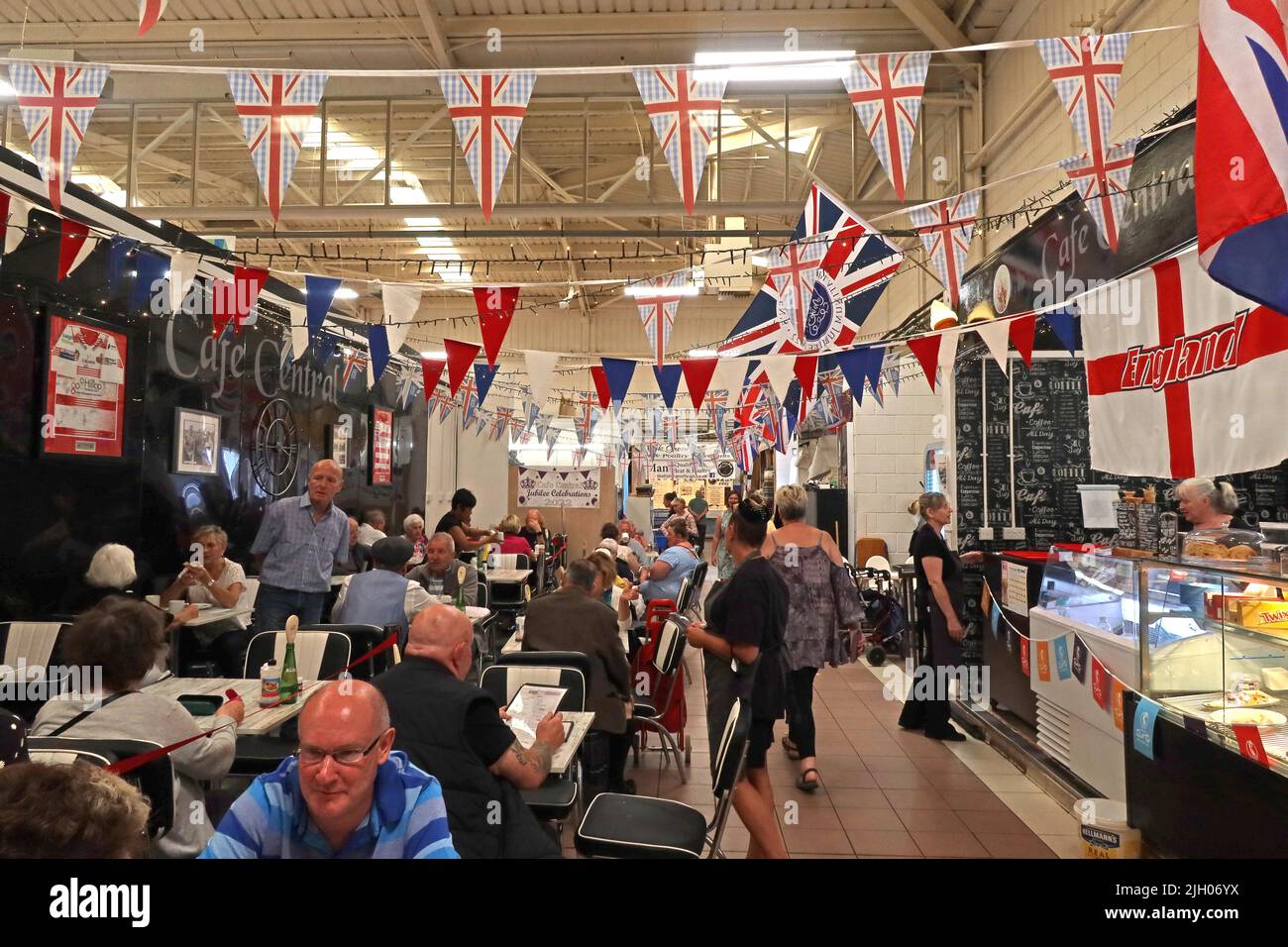 Cafe Central at Leigh covered indoor market hall with flags / bunting, Gas St, Leigh, Lancashire, England, UK,  WN7 4PG Stock Photo