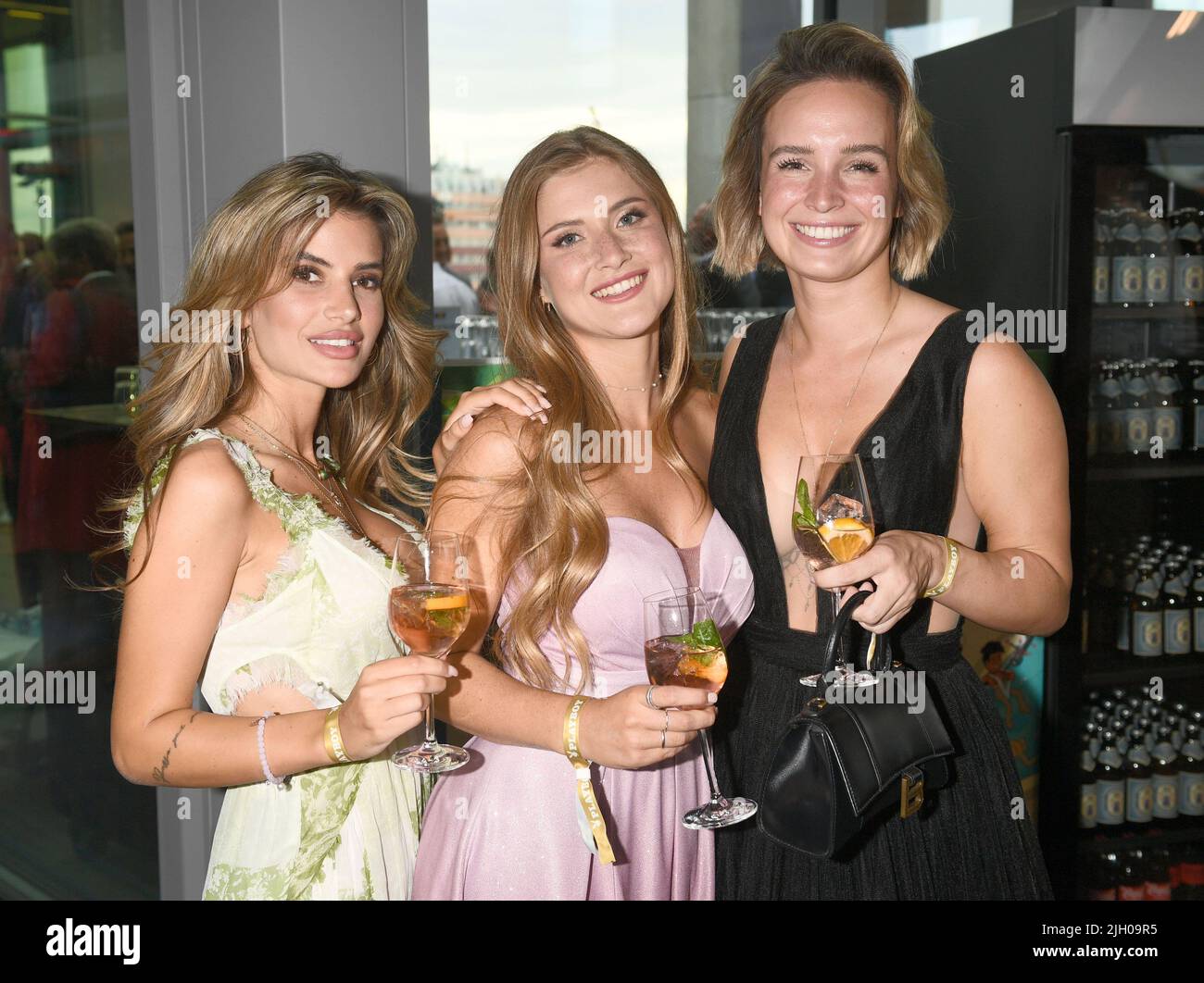 Munich, Germany. 13th July, 2022. Playmates Laura Schultz (l r), Vanessa Teske and Julia Römmelt