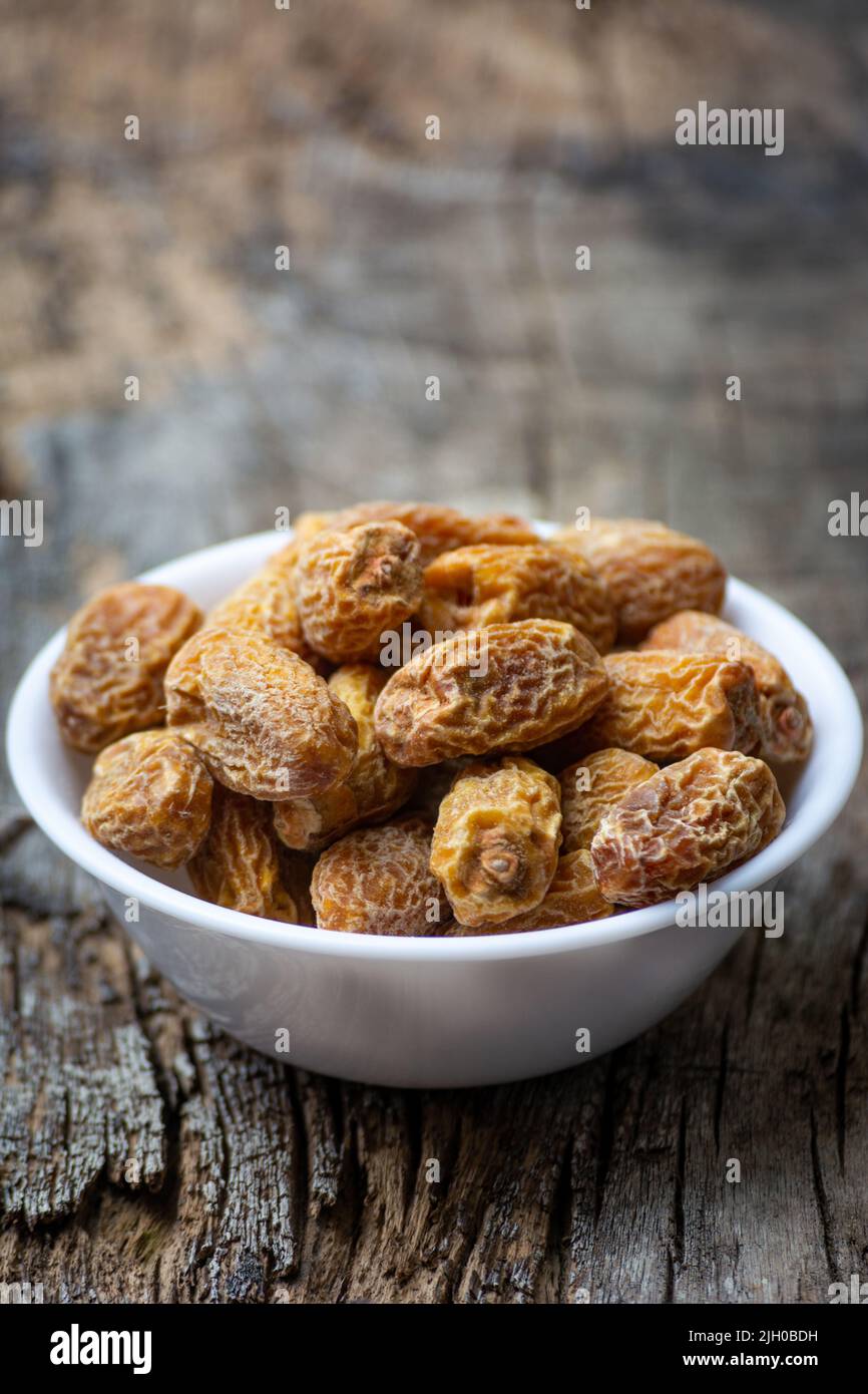Indian dry dates in white bowl Stock Photo Alamy