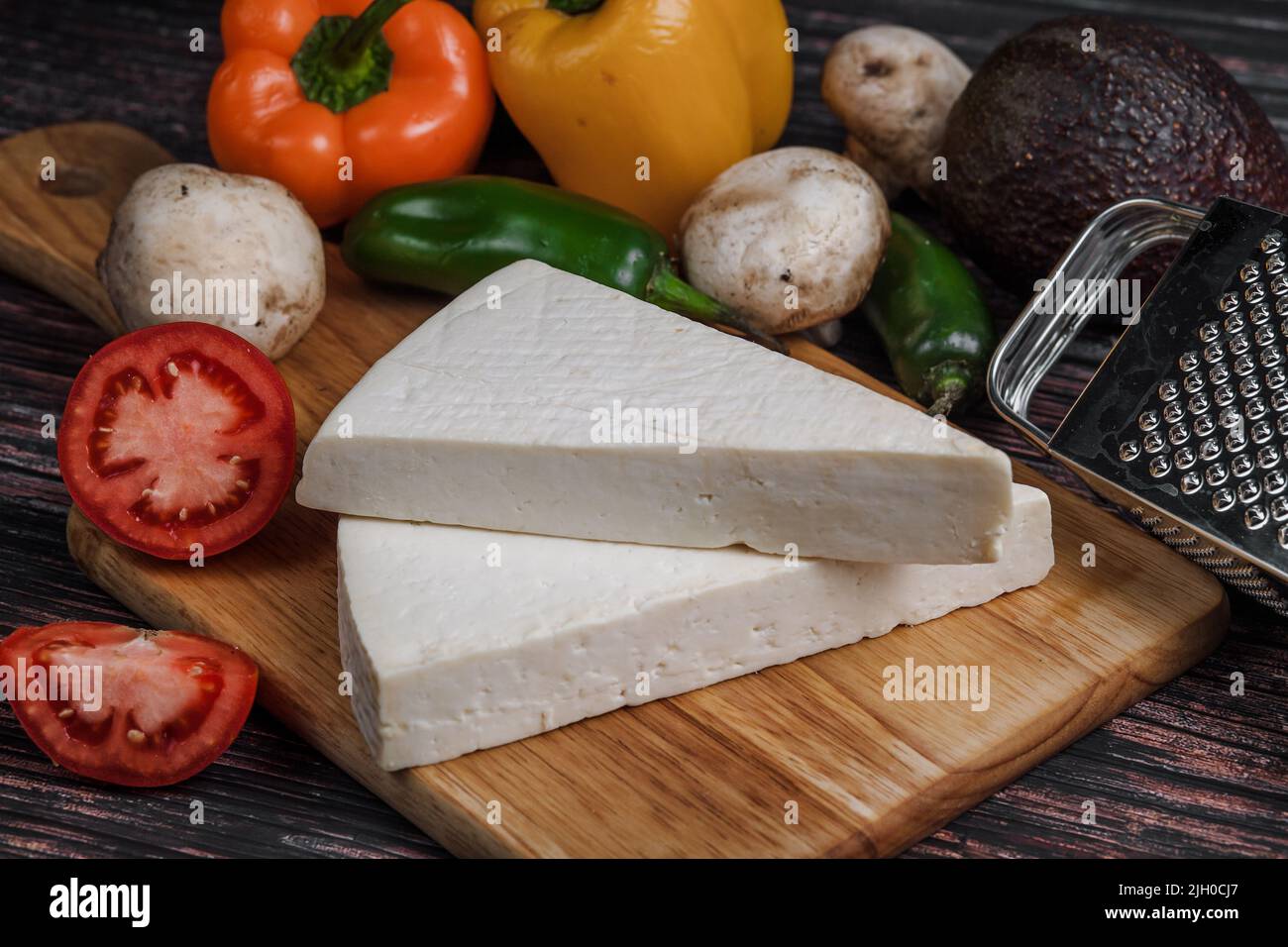 Mexican white Cotija cheese with fresh ingredients in Mexico Latin America Stock Photo