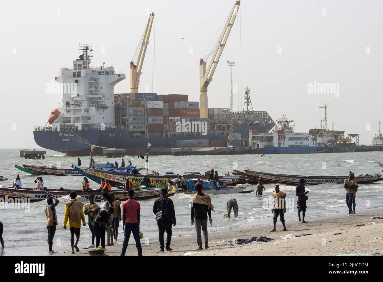PORTUGUESE TOWN, BANJUL, THE GAMBIA - FEBRUARY 10, 2022 container ship unloading Stock Photo