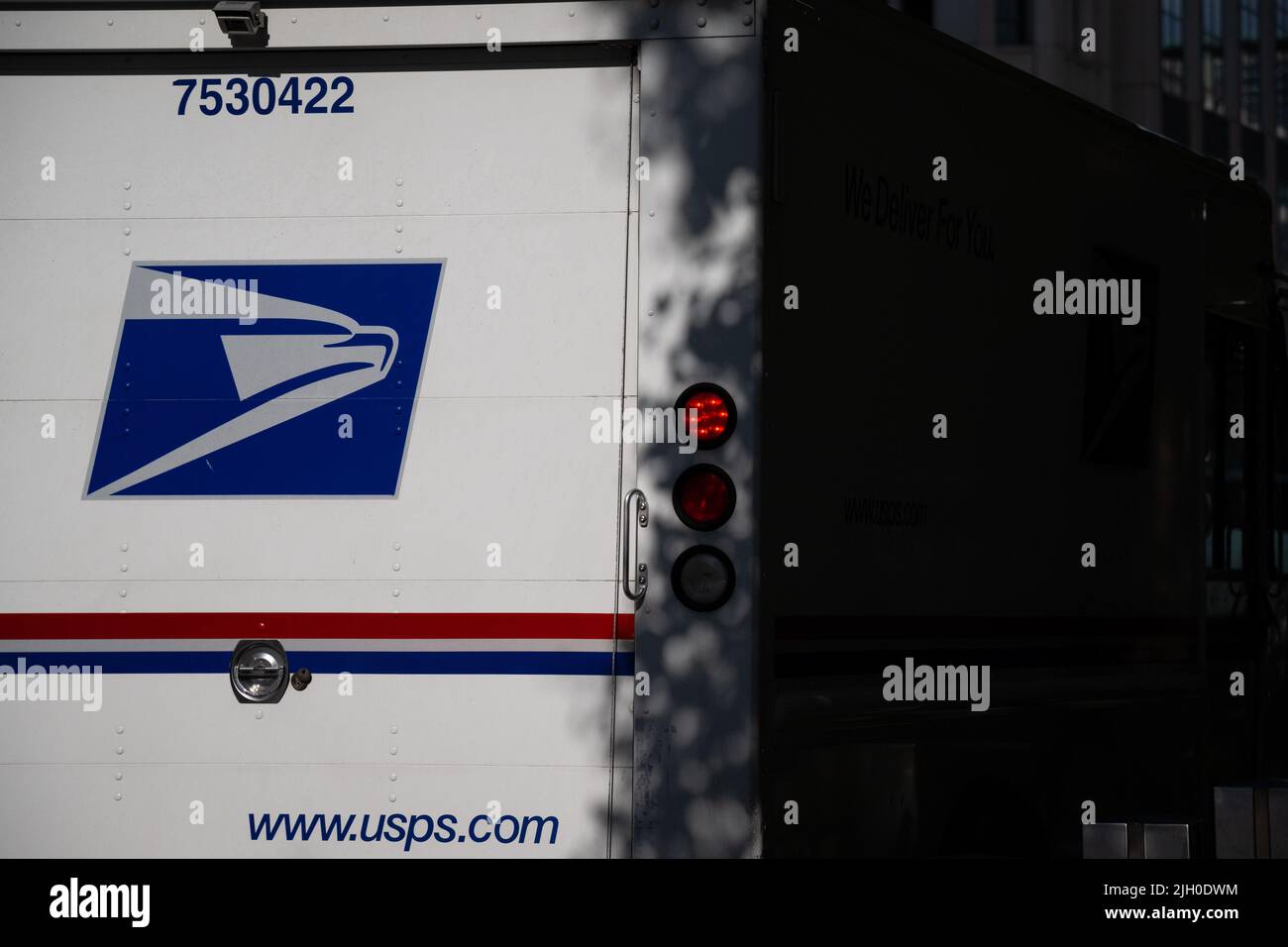 A general view of a U.S. Postal Service (USPS) delivery truck parked on