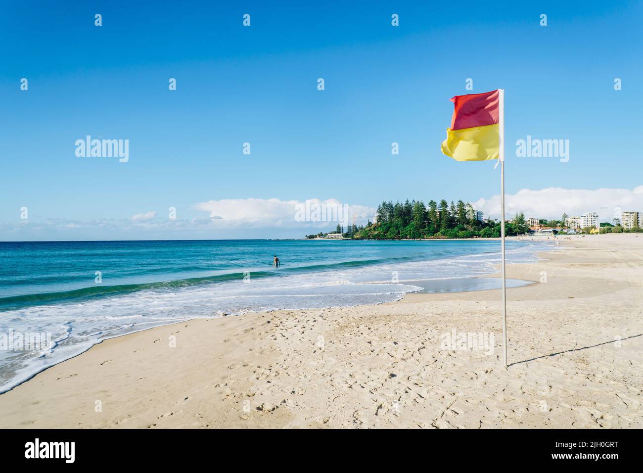 Greenmount headland with lifeguard flag on the Gold Coast Stock Photo