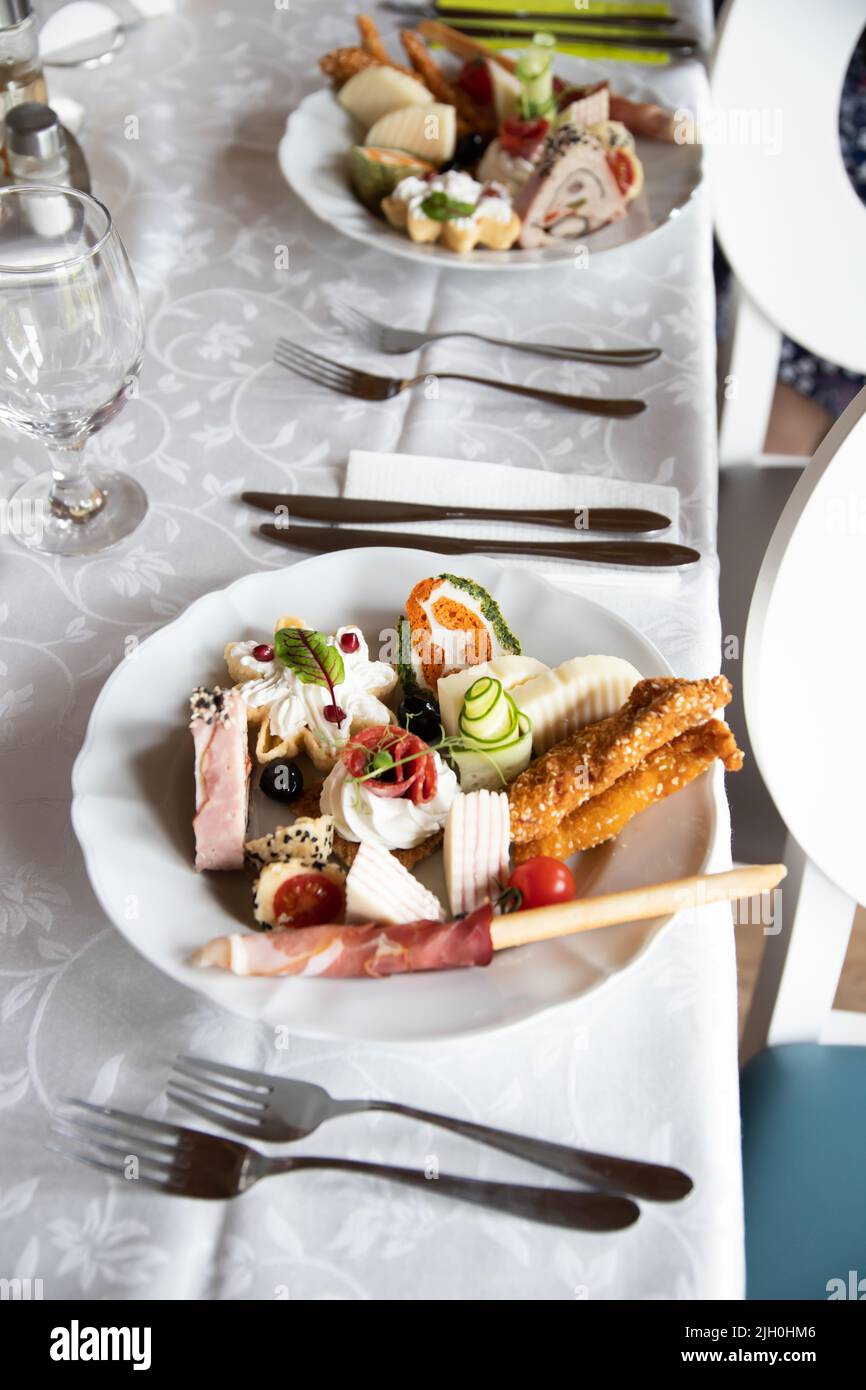 Different tasty appetizers on luxury banquet or wedding table Stock ...