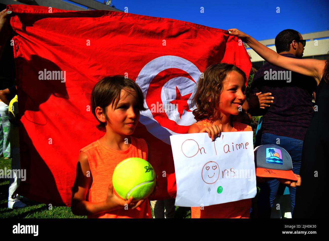 Fans of Tunisian tennis player Ons Jabeur   after her return to the capital Tunis from Wimbeldon, on July 13, 2022. Hailing her as the &quot;nation's pride&quot; and &quot;ambassador of happiness&quot;, Tunisians remained enthralled with tennis star Ons Jabeur, celebrating her presence in the prestigious Wimbledon final despite her loss. (Photo by Yassine Mahjoub/Sipa USA) Stock Photo
