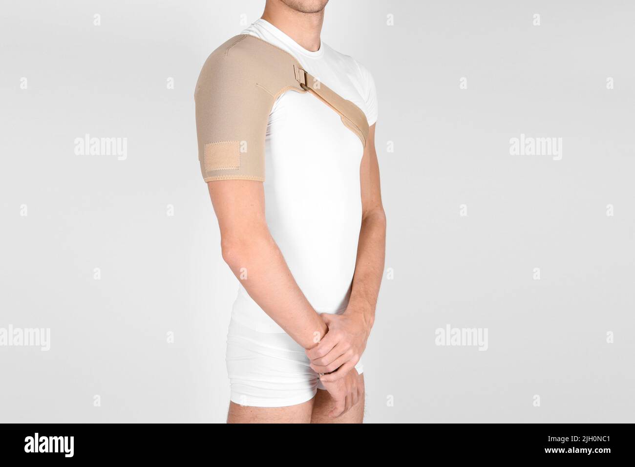 Shoulder joint orthosis or brace isolated on white background. A man in