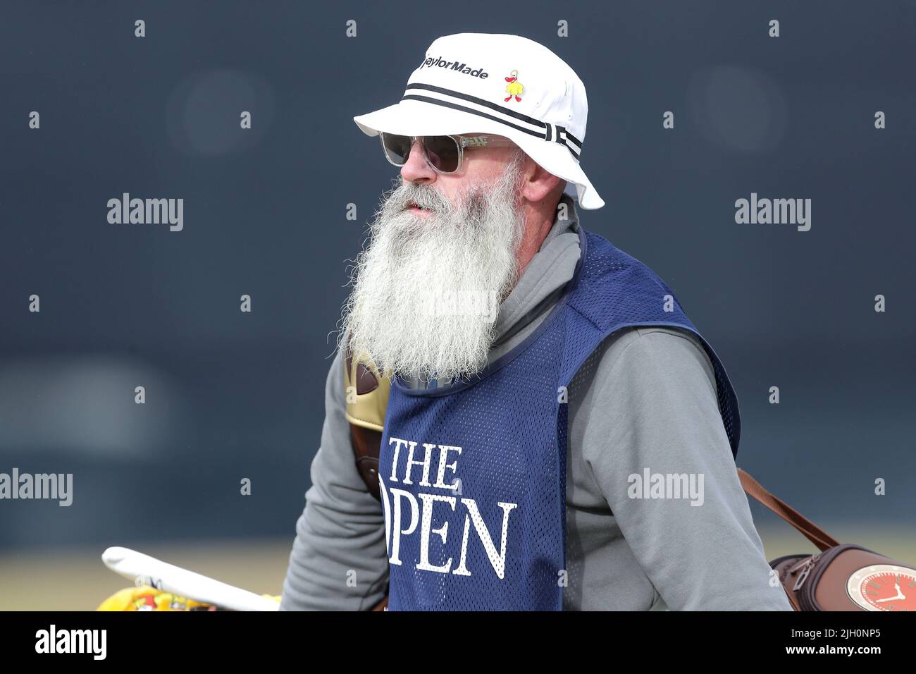 Australia's Lucas Herbert's caddie Nick Pugh makes his way to the 3rd